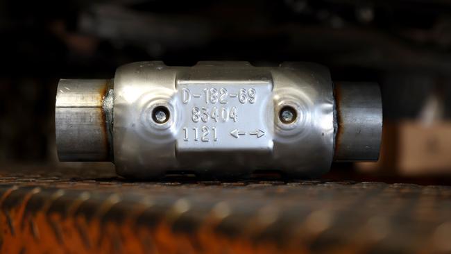 A brand new catalytic converter sits on a car lift. Picture: Justin Sullivan/Getty Images