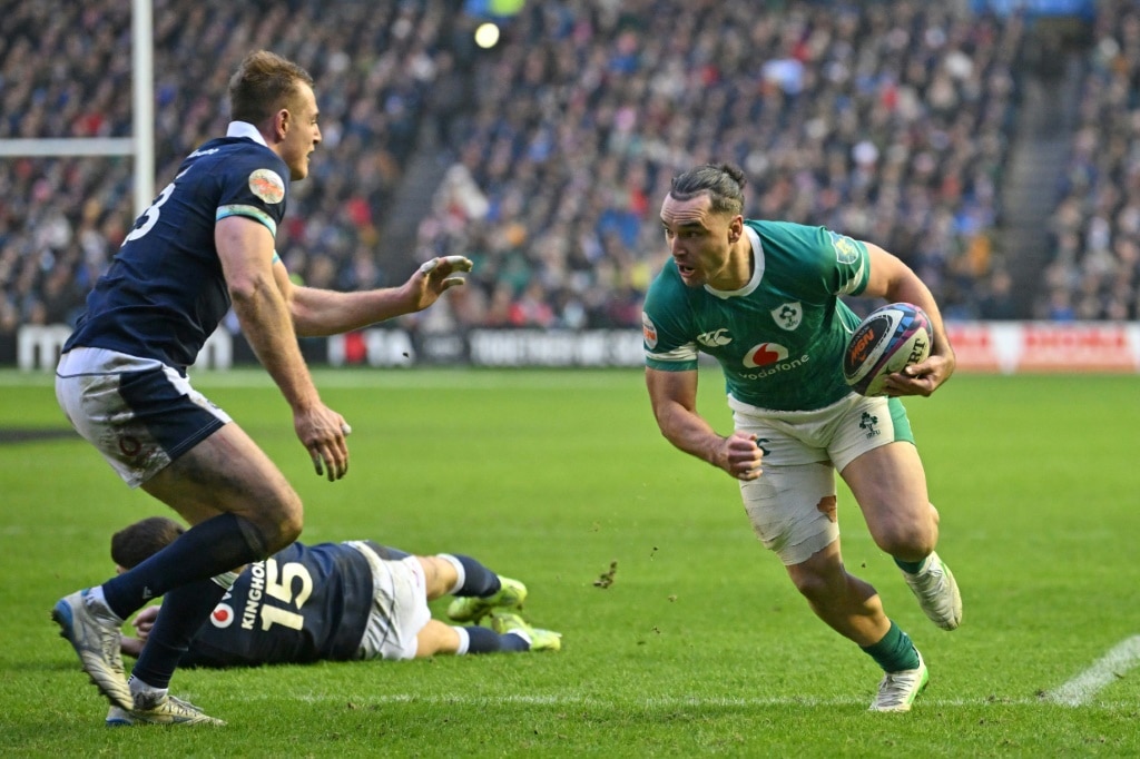 Clinching score: James Lowe (R) runs at Stafford McDowall (L) on his way to Ireland's third try in a 32-18 Six Nations win over Scotland at Murrayfield