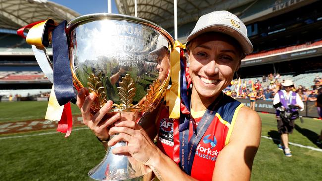 Erin Phillips of the Crows poses for a photo with the premiership cup. Photo by Dylan Burns/AFL Photos via Getty Images.