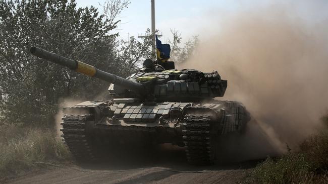 A Ukrainian tank rolls down a road along the front line in the Donetsk region. Picture: AFP