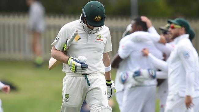Australian captain Steve Smith departs after being dismissed by South African bowler Kagiso Rabada.