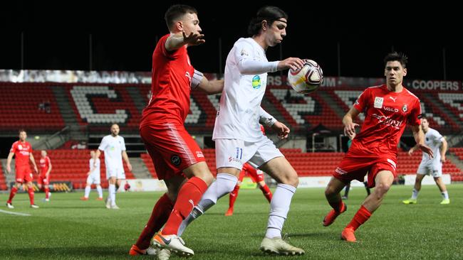 Adelaide Comets player Jayden Lobasso controls the ball during last season’s NPL SA grand final loss to Campbelltown City. Picture: AAP/Emma Brasier