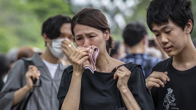 A grieving woman during the funeral for former Japanese Prime Minister Shinzo Abe at Zojoji temple on Tuesday. Picture: Getty Images