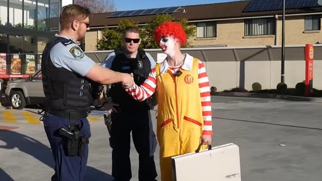 Ronald McDonald (aka Floppy) and police officers made peace. Picture: Floppy/ YouTube