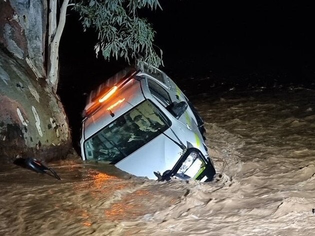 A car that was washed away in floodwater on Outback Highway in the northern Flinders Ranges near Beltana.