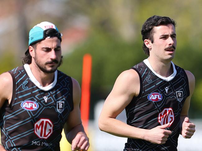 ADELAIDE, AUSTRALIA - SEPTEMBER 12: Lachie Jones, Josh Sinn and Jase Burgoyne during a Port Adelaide Power captain's run at Alberton Oval on September 12, 2024 in Adelaide, Australia. (Photo by Sarah Reed/Getty Images)