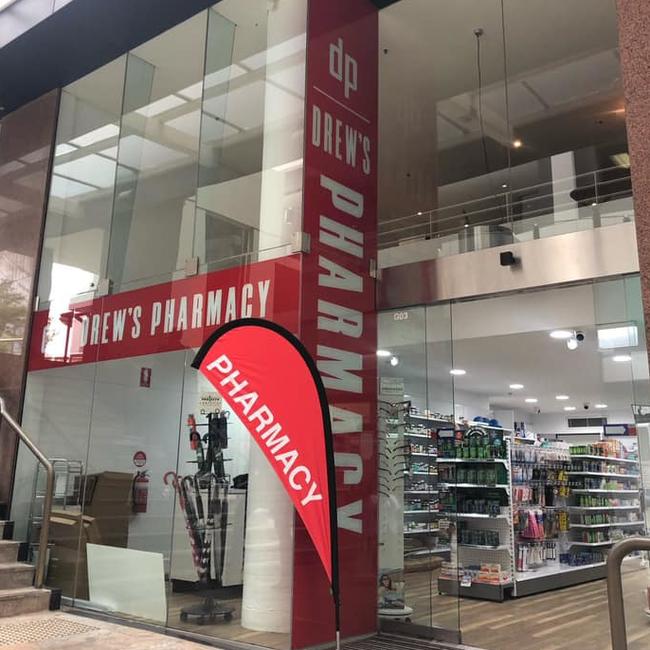 Luc Bonnell used a plank of wood to prise open the door of Drews Pharmacy at North Sydney. Picture: Facebook (Drews Pharmacy)