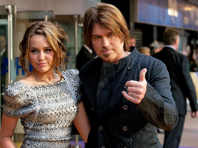 With daughter Miley back in 09 when he was rockin’ the ‘Keith Urban’ look.