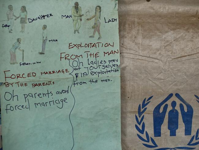 A sign promoting knowledge of gender issues hangs on the wall at a women’s centre for South Sudanese refugees focusing on sexual and gender-based violence. Picture: Ben Curtis/AP