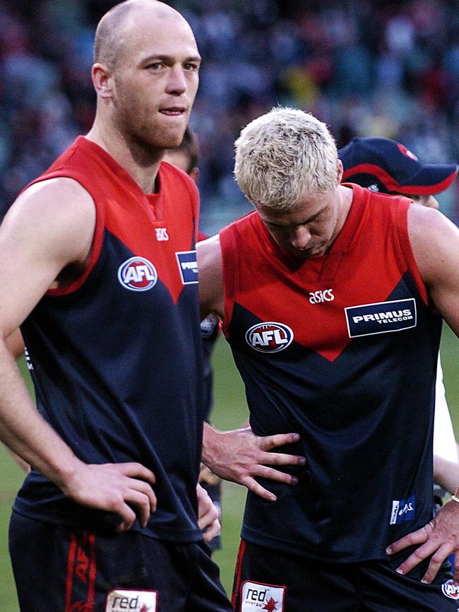 Demons Alistair Nicholson and Nathan Caroll after the loss to the Cats.