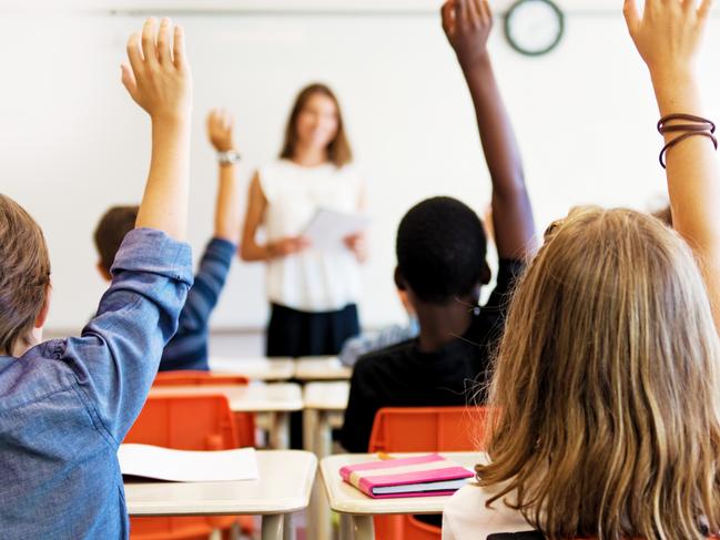 School kids in classroom. Generic (stock) photo of children in a classroom with teacher in background.Picture: iStock