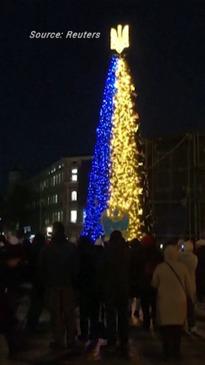 Christmas tree sparkles in dark Kyiv