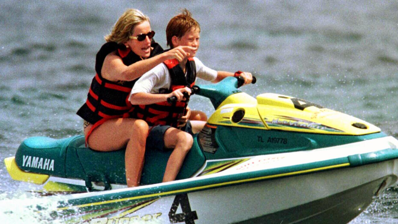 Diana with Prince Harry riding a jet ski while on holiday in St Tropez.