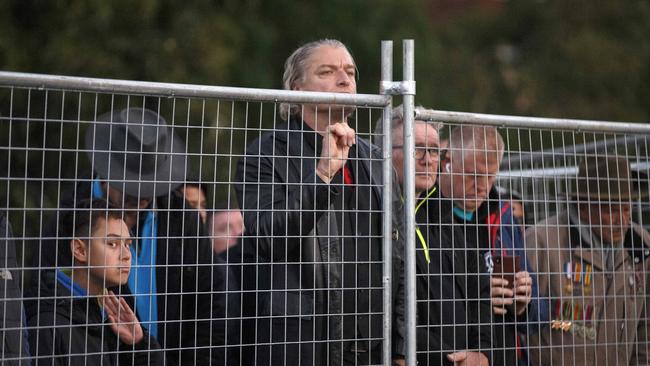 People without tickets to the Dawn Service watch from outside the fence. Picture: NCA NewsWire/David Geraghty