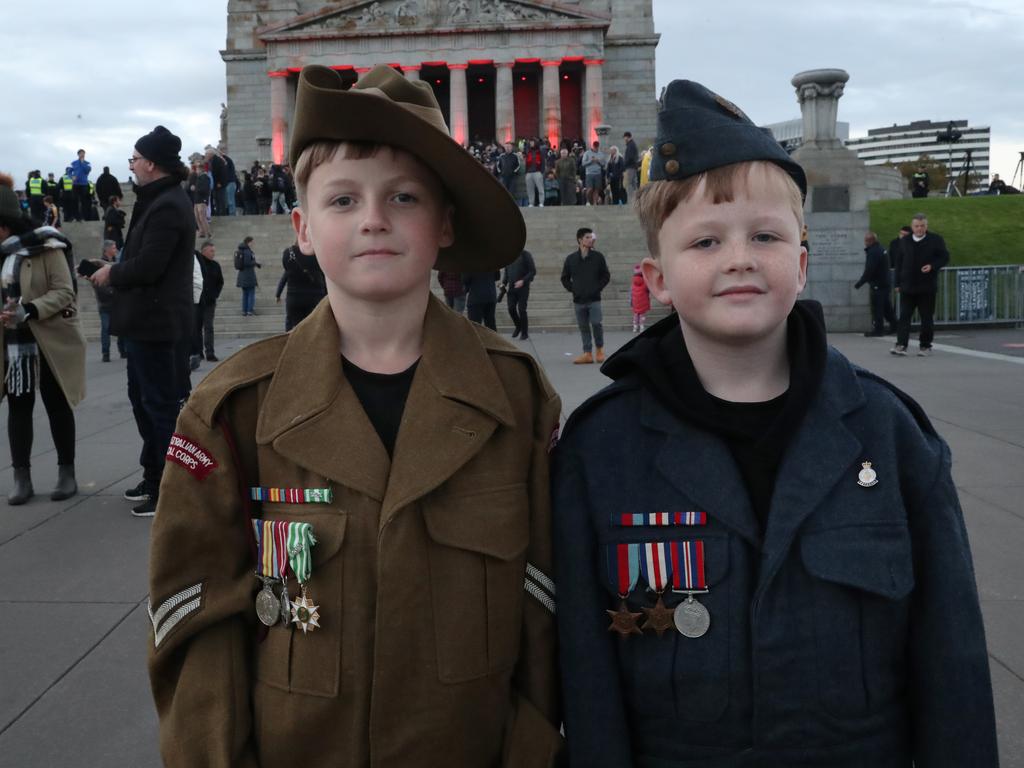 Braydin Harrison representing his grandfather from the Vietnam War and Saxon Harrison representing his great grandfather from World War II. Picture: David Crosling