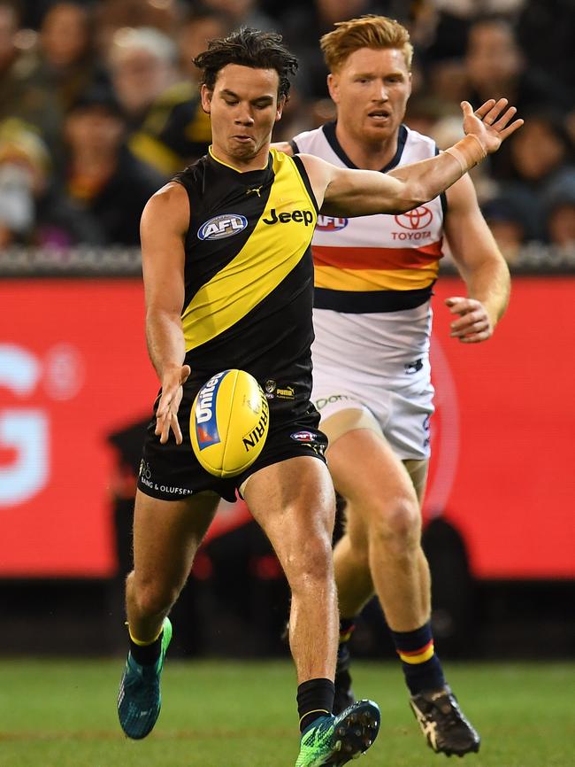 Kyle Cheney in pursuit of Daniel Rioli. Picture: AAP Image/Julian Smith