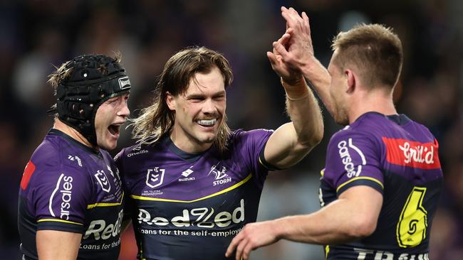 MELBOURNE, AUSTRALIA - SEPTEMBER 27:  Ryan Papenhuyzen of the Storm celebrates with team mates after scoring a try during the NRL Preliminary Final match between the Melbourne Storm and Sydney Roosters at AAMI Park on September 27, 2024 in Melbourne, Australia. (Photo by Cameron Spencer/Getty Images)