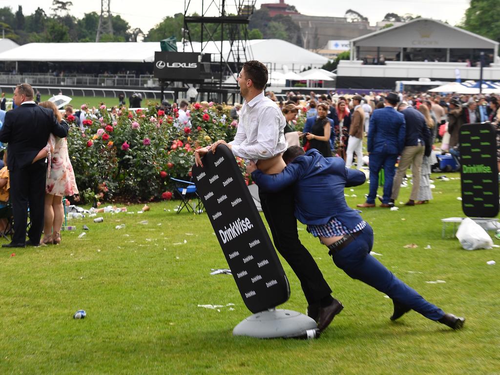 Pushing over that DrinkWise sign is probably not that wise. Picture: Jason Edwards