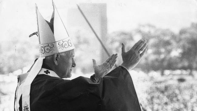 Pope John Paul II gestures from the podium during a papal mass at Victoria Park Racecourse, Adelaide, in 1986.