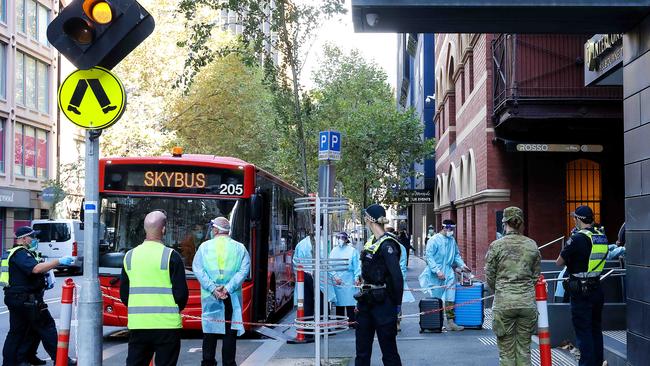 Travellers from overseas arrive at the InterContinental Hotel in Melbourne for their Covid-19 quarantine period. Picture: Ian Currie