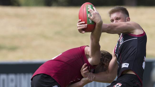 Seb Ross, right, wrestles the ball from team-mate Jack Steven earlier in the pre-season.