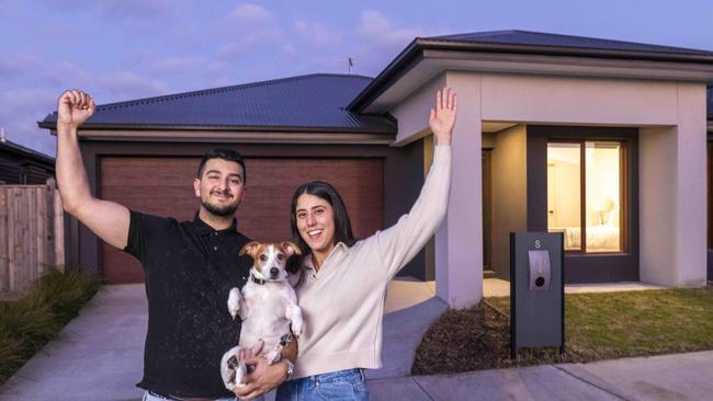 Terry Talarico and fiance Monique Chetcuti at their home in Melbourne’s north, one of three properties they own, with pet dog BamBam. Picture: Wayne Taylor.