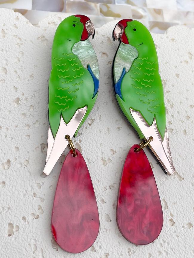 Swift parrot earrings handcrafted by Trinidad Roldan Rojas, who makes and sells her creations under the business name Galactic Burrito. Picture: Supplied