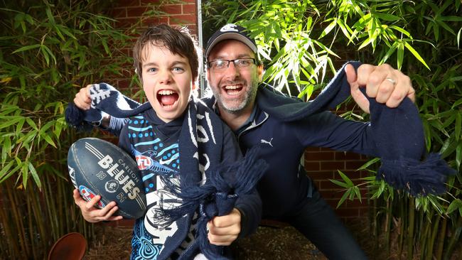 Mike Johnston and his son, Alex, 11 are among 67,035 Carlton members. Picture: Alex Coppel.