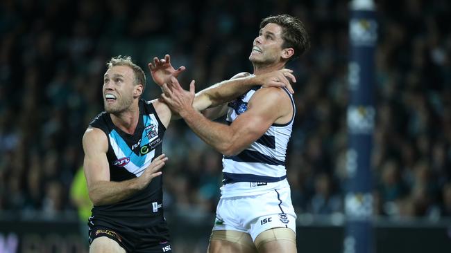 Jack Hombsch of the Power wrestles for position with Tom Hawkins. Picture: Ben Macmahon (AAP)