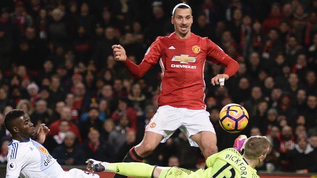 Manchester United's Swedish striker Zlatan Ibrahimovic (C) scores.