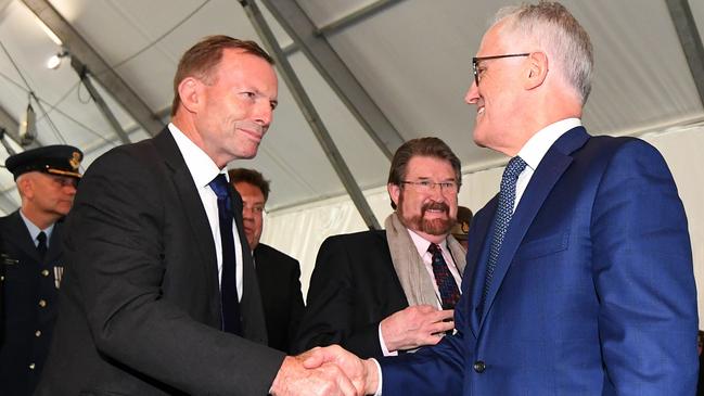 Bitter enemies … Tony Abbott (left) shakes Malcolm Turnbull’s hand at the official opening of the Sir John Monash Centre at Villers-Bretonneux in April this year. Photo: AAP