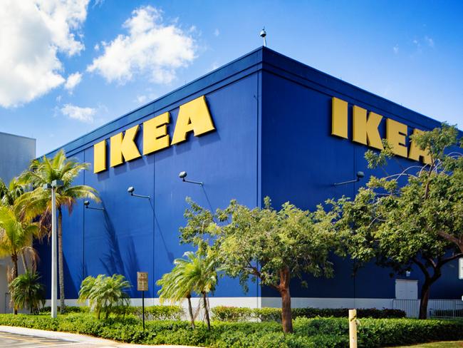 Corner view of the Ikea furniture store in Sunrise Florida near Fort Lauderdale on a mostly sunny Winter day. The image features the typical blue store with the yellow logo on its wall.