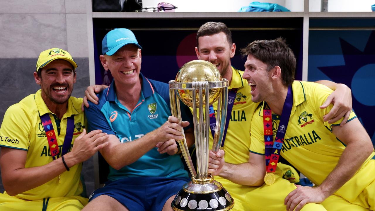 Mitchell Starc, Josh Hazlewood, Mitch Marsh and Andrew McDonald, with the ICC Men's Cricket World Cup Trophy . Photo by Robert Cianflone/Getty Images)