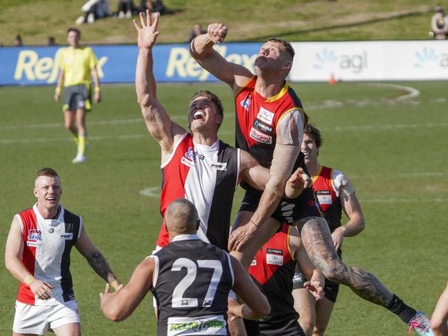 Danny Ades (right) contests a throw in. Picture: Valeriu Campan