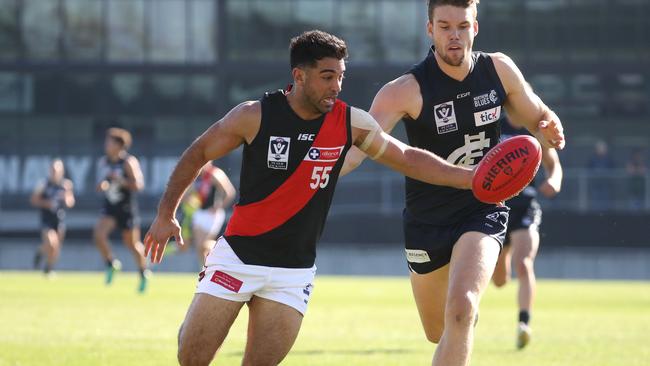 Danny Younan evades Northern Blues defender Harrison Macreadie during a game earlier this year. Picture: Mark Dadswell.