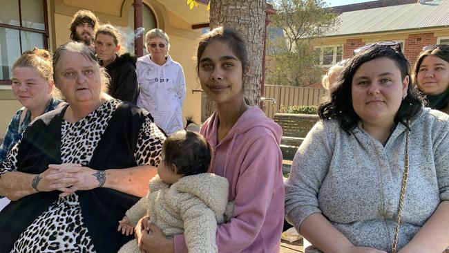 Family and friends of Brandon Clark, including his mother Kate Leland (front left), brother Ben Clark (behind her) and Ben's wife Ayesha with their baby outside Taree Local Court on the first day of the inquest into Brandon Clark's death. Picture: Janine Watson