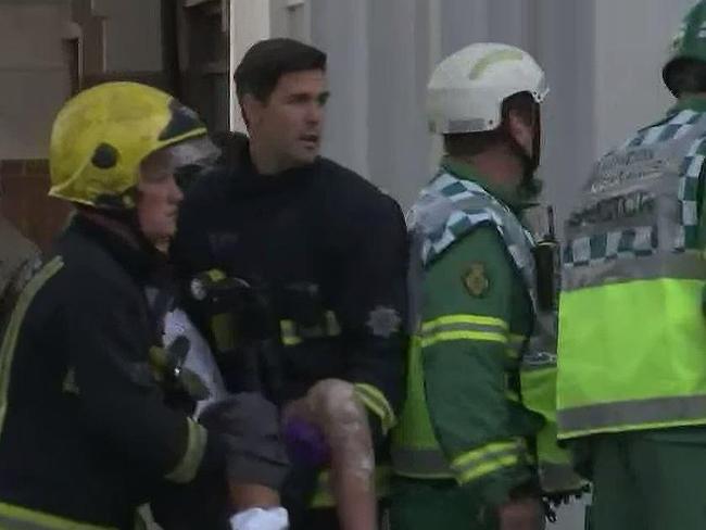 An injured woman is carried from the scene. Picture: Twitter