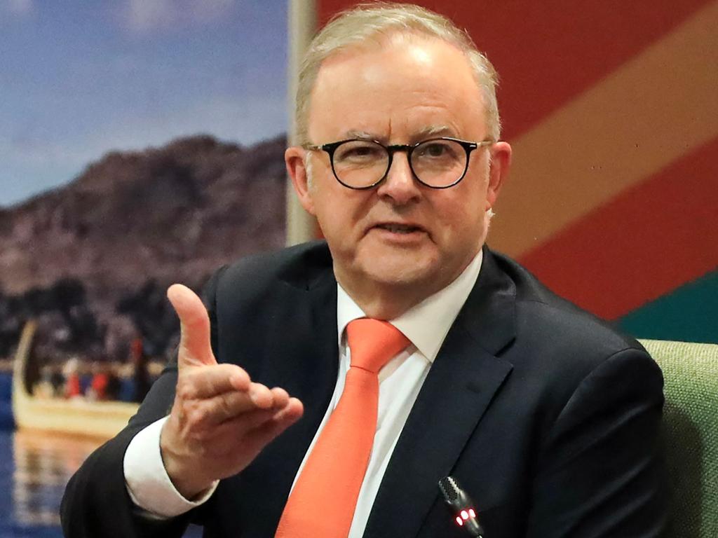 Prime Minister Anthony Albanese the papers the public servants put in front of him. Picture: AFP