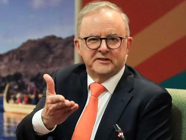 Prime Minister Anthony Albanese the papers the public servants put in front of him. Picture: AFP