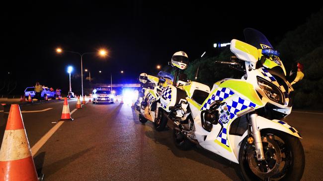 Queensland Police set up a road block due to the Corona Virus at the NSW / Queensland Border on the old Pacific Highway at Coolangatta. Photo: Scott Powick Newscorp