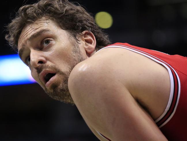 FILE - This is a Sunday, April 3, 2016 file photo of Chicago Bulls center Pau Gasol looks up as the Milwaukee Bucks take a free throw during the second half of an NBA basketball game, in Milwaukee . Pau Gasol says he is considering not playing at the Olympics because of the Zika virus. The Spanish basketball player says there is too much uncertainty about the situation in Brazil and anyone going to Rio de Janeiro for the games should "think about" whether it's worth the risk. (AP Photo/Darren Hauck, File)