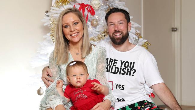 Charli Robinson and Liam Talbot and their baby girl Kensington. Pic Peter Wallis