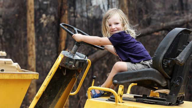 Jack Hyde on his grandfather’s tractor after the fire. Picture: Gaye Gerard