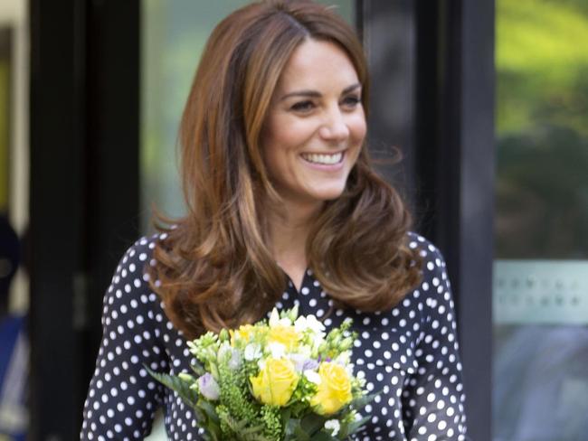 Britain's Catherine, Duchess of Cambridge carries a posy as she leaves after her visit to the Sunshine House Children and Young People's Health and Development Centre to meet with the Southwark Family Nurse Partnership team and highlight their valuable work, in Peckham, south London on September 19, 2019. (Photo by Ian Vogler / POOL / AFP)