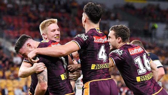 Darius Boyd of the Broncos celebrates scoring a try in his final game for the broncos