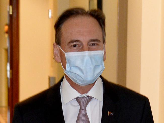 MELBOURNE, AUSTRALIA - NewsWire Photos JULY 05, 2021: Commodore Eric Young of the Vaccine Operations Centre (VOC) and Federal Health Minister Greg Hunt arrive to speak to the media at the Commonwealth Parliamentary Office, Melbourne. Picture: NCA NewsWire / Andrew Henshaw