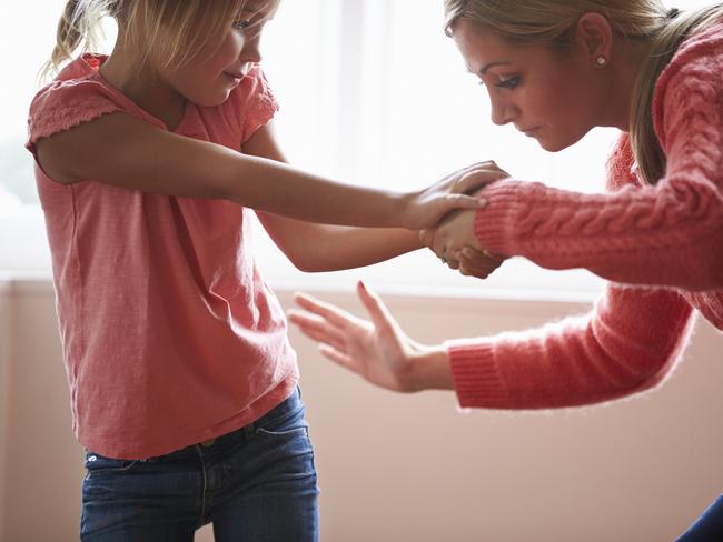 Mother Hitting Young Daughter . iStock