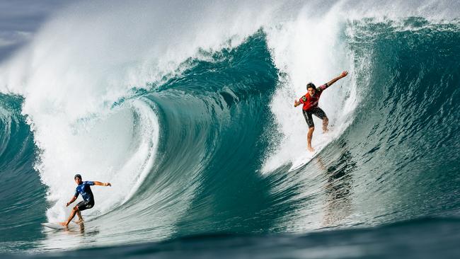 Callum Robson, left, on the same wave as three-time WSL Champion Gabriel Medina Picture: Brent Bielmann/World Surf League