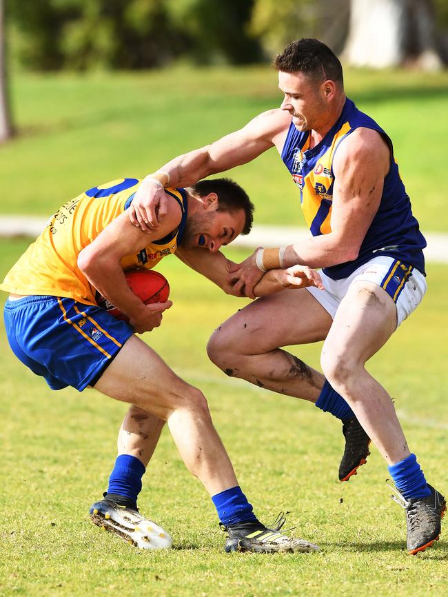 Gaza’s Damon Hill attempts to shrug a tackle from PHOS Camden opponent Aaron Bergsma. The Eagles battled in division two this season. Picture: AAP/Mark Brake