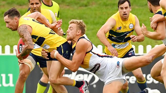 13/04/19 - SANFL: Eagles v Adelaide at Woodville Oval.  Adelaide's Hugh Greenwood tackles Eagles' James Boyd.Picture: Tom Huntley